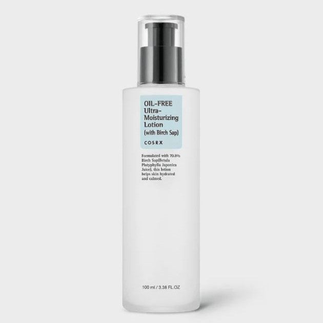 A 100ml bottle of COSRX - Oil-Free Ultra-Moisturizing Lotion with Birch Sap 100ml. The white bottle features a black pump dispenser and clear lid. The label includes product information in blue and black text, highlighting its effectiveness in restoring moisture and soothing irritated skin.