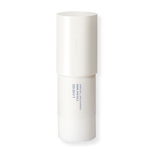 A white cylindrical bottle of LANEIGE - Cream Skin Cerapeptide Refiner 170ml. The bottle has a minimalist design with a large white cap, and the Laneige logo and product name are printed in blue text on the lower half. Infused with ceramides, this refiner ensures your skin stays hydrated throughout the day.
