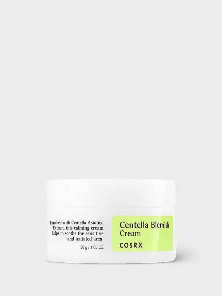 A white jar of COSRX - Centella Blemish Cream 30ml with a green label. The text on the jar describes it as a 30g (1.05 oz) soothing cream enriched with Centella Asiatica extract, designed as an acne scar treatment to calm and soothe sensitive and irritated areas of the skin.