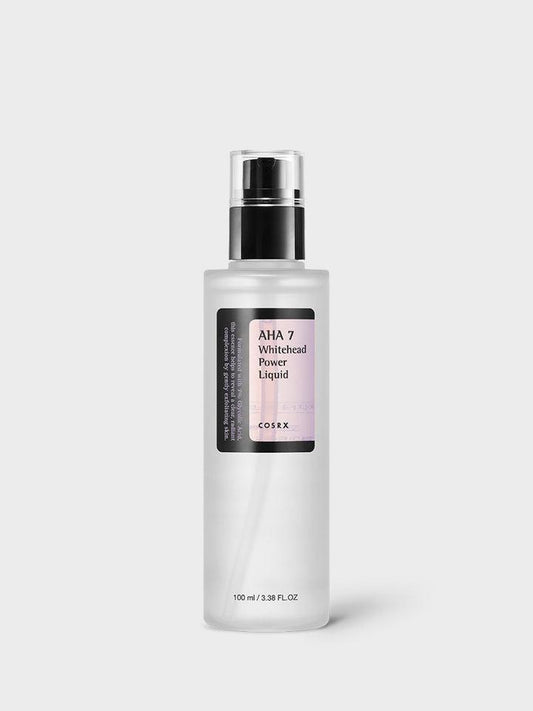 A clear bottle of COSRX - AHA 7 Whitehead Power Liquid 100ml containing 100 ml (3.38 fl oz) of the product highlights its brightening benefits through effective AHA exfoliation. The bottle features a black pump dispenser and a label with product information on the front. The background is plain white.