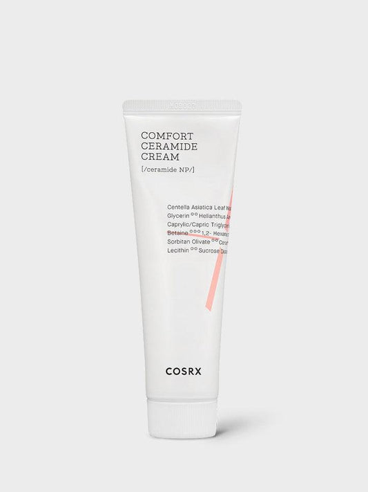 A white tube of COSRX - Balancium Comfort Ceramide Cream 80ml, a lightweight moisturizer, against a light gray background. The tube has black text listing ingredients like Centella Asiatica Leaf Water and Ceramide NP. The product name and brand logo appear on the front.