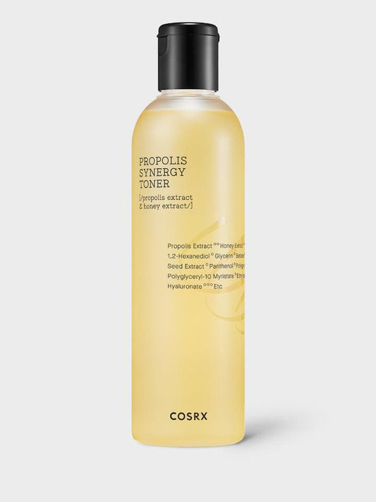 A bottle of COSRX - Full Fit Propolis Synergy Toner 280ml. The translucent yellow liquid, enriched with black bee propolis and honey extract, is visible through the clear bottle with a black cap. The label lists key ingredients in dark text, highlighting the nourishing properties of this toner.