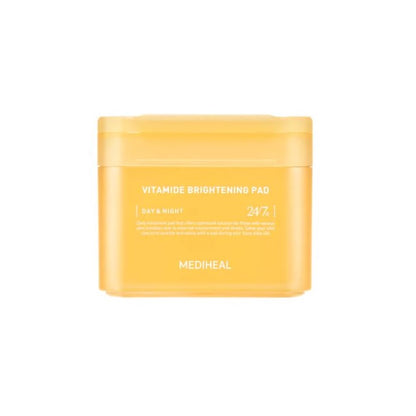 A bright yellow rectangular container of MEDIHEAL - Vitamide Brightening Pad 100ea, also known as the glow-getter pad. The label indicates its use for both day and night skincare, promoting radiant skin with its niacinamide formula.
