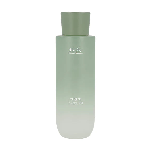 A green gradient bottle with a matte finish, featuring Korean text on the front. The cap is a darker shade of green and cylindrical in shape. The bottle, which soothes skin with its green herbal scent, has a minimalistic design, giving it a sleek and modern appearance. This is the HANYUL - Pure Artemisia Watery Calming Toner 150ml from HANYUL.