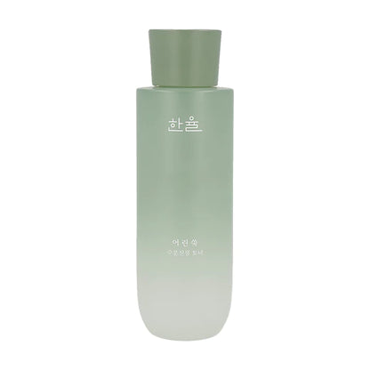 A green gradient bottle with a matte finish, featuring Korean text on the front. The cap is a darker shade of green and cylindrical in shape. The bottle, which soothes skin with its green herbal scent, has a minimalistic design, giving it a sleek and modern appearance. This is the HANYUL - Pure Artemisia Watery Calming Toner 150ml from HANYUL.