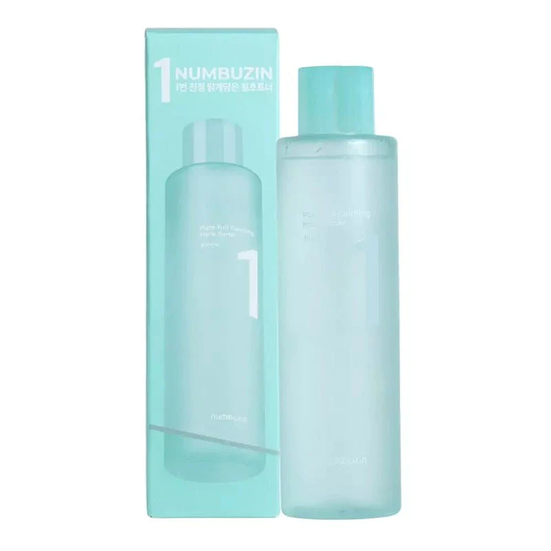 A light blue bottle labeled "No.1 Pure-Full Calming Herb Toner 300ml" stands beside its matching box. The bottle and box feature white text, with the bottle having a blue cap. This skincare item, made by Numbuzin, incorporates soothing ingredients like Houttuynia Cordata for enhanced effectiveness.