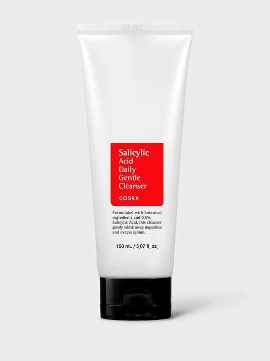 A white tube of COSRX - Salicylic Acid Daily Gentle Cleanser 150ml with a red label. The non-drying daily cleanser is formulated with botanical ingredients and 0.5% salicylic acid. The tube contains 150 ml (5.07 fl. oz.) of product, designed to gently cleanse impurities, excess sebum, and act as an effective acne cleanser.