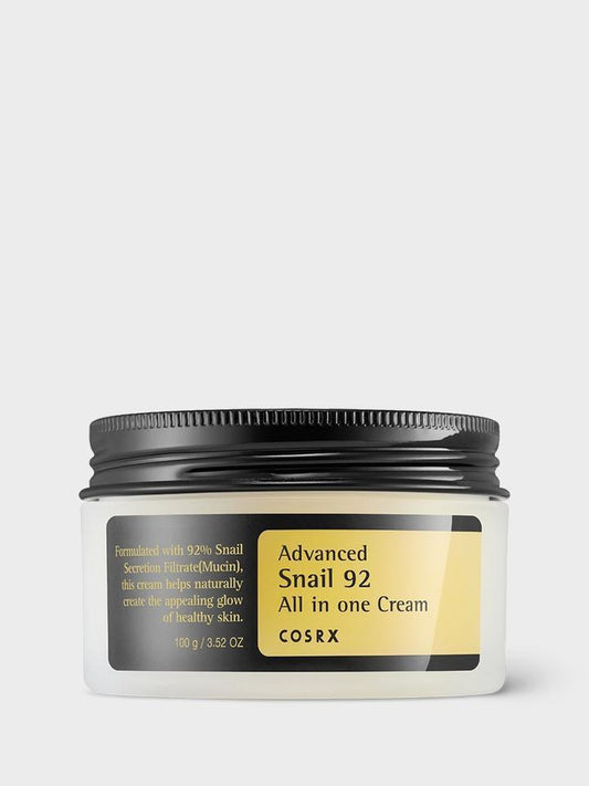 A jar of COSRX - Advanced Snail 92 All in one Cream 100ml, a cruelty-free moisturiser with 100g (3.52 oz) of product. The label highlights 92% snail mucin to promote healthy skin. The jar features a black lid and a yellow label against a white background.