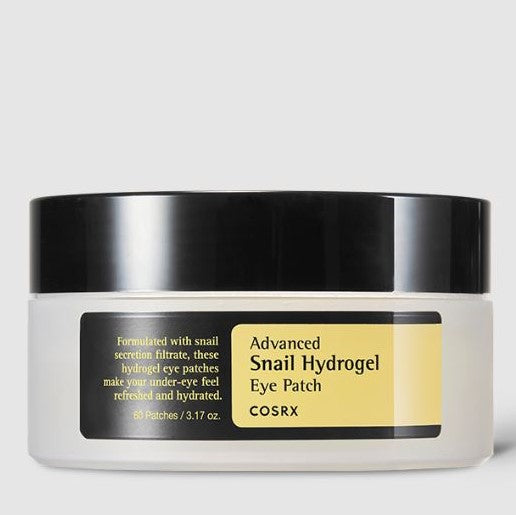 A container of COSRX - Advanced Snail Hydrogel Eye Patch 60ea is shown against a plain background. The product label mentions it contains snail secretion filtrate to hydrate the delicate eye area and aims to make it feel refreshed. The container includes 60 patches and holds 3.17 oz.