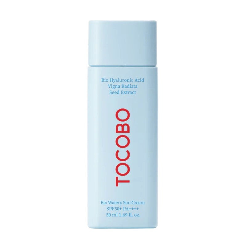 A light blue bottle labeled "Tocobo" in red text contains TOCOBO - Bio Watery Sun Cream SPF50+ PA++++ 50ml. The vegan and cruelty-free formula includes Bio Hyaluronic Acid and Vigna Radiata Seed Extract. It has a 50 ml or 1.69 fl. oz. capacity.